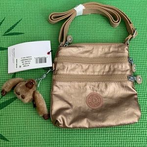 Kipling golden crossbody bag.
